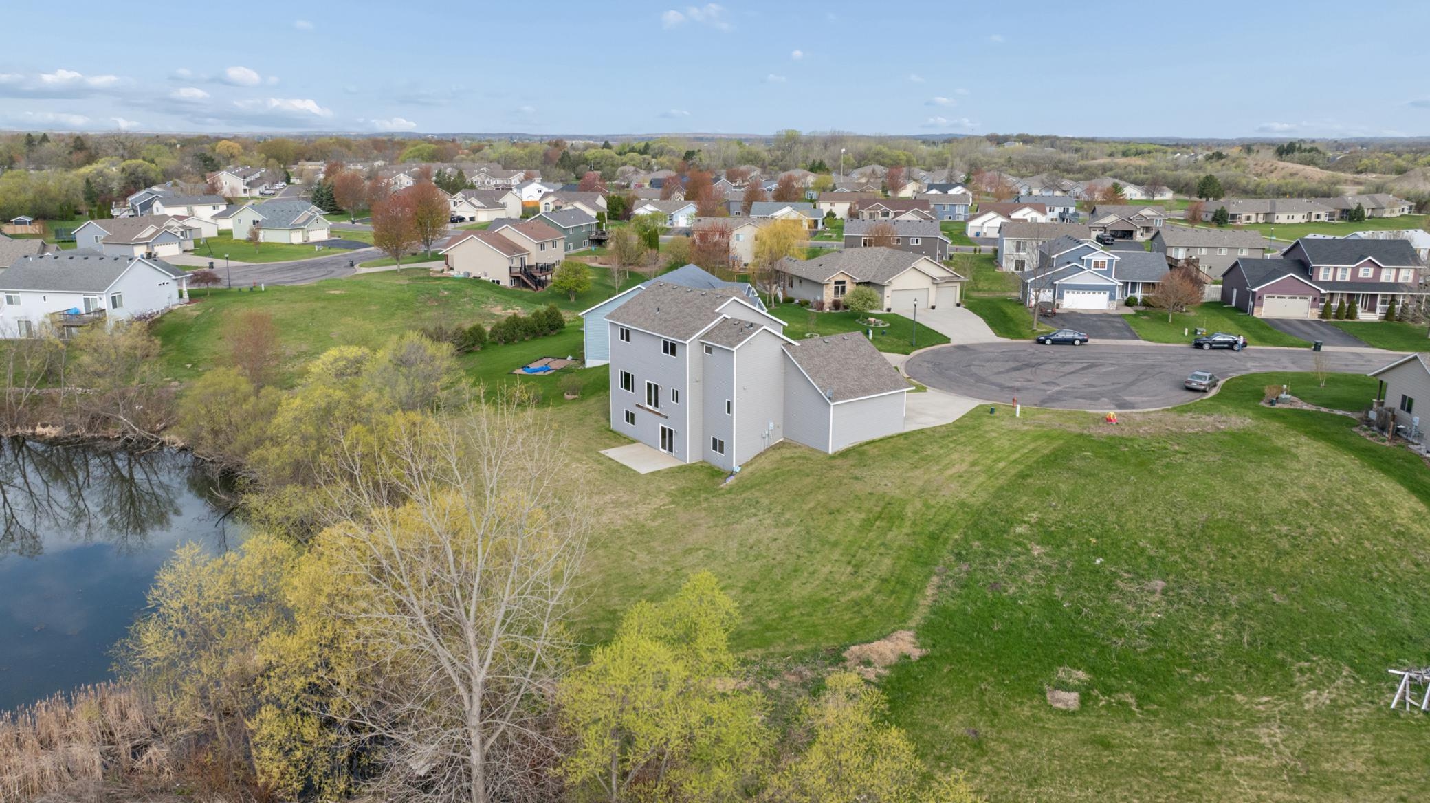 Stunning aerial views showcase the home, neighborhood, and surrounding beauty.