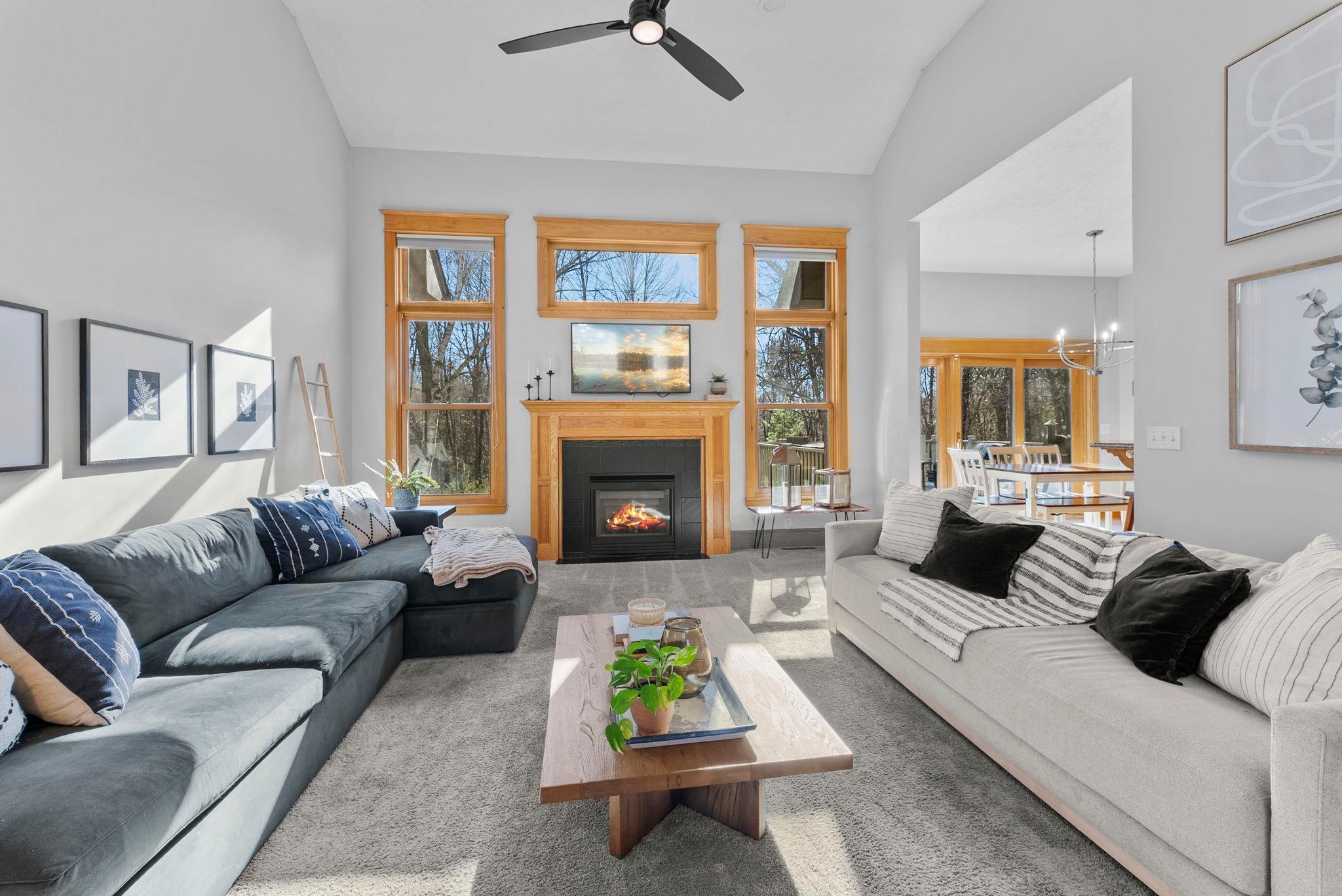 Vaulted ceilings, cozy fireplace, and all the natural light