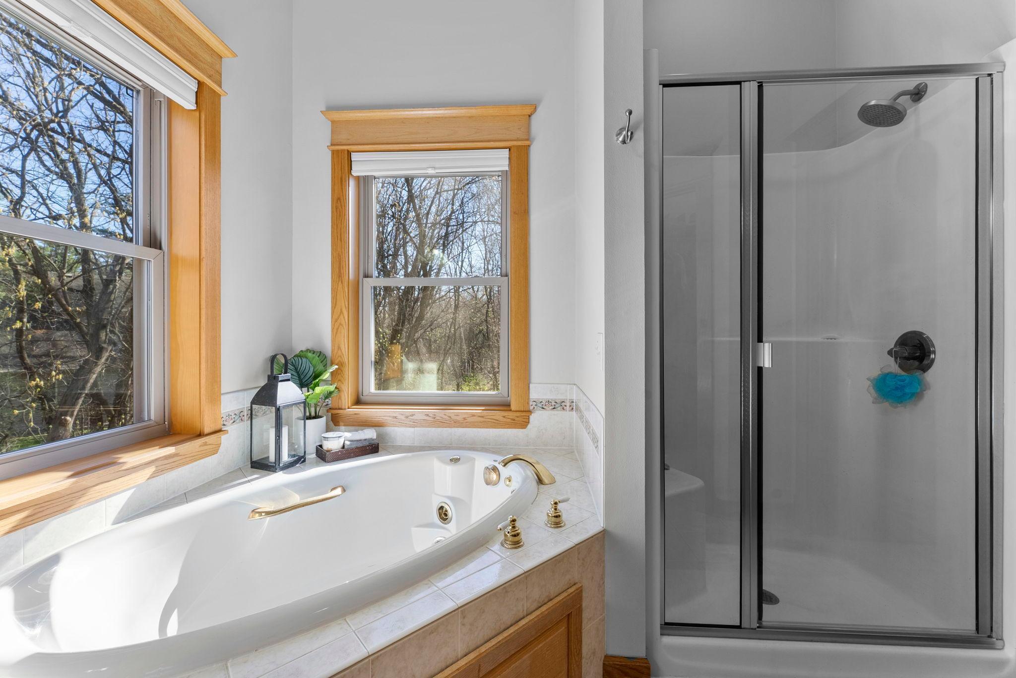 Ensuite bath = ultimate convenience with soaking tub, separate shower, and natural light