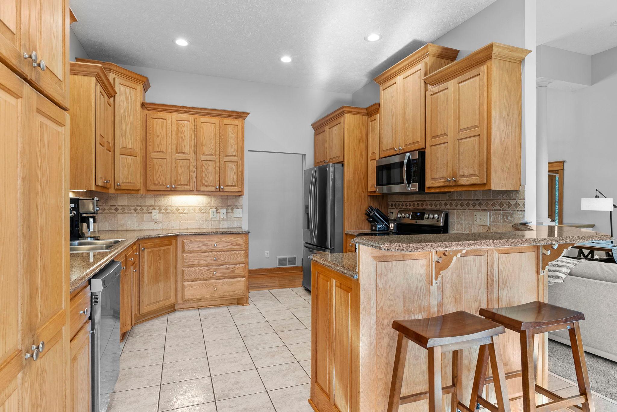 Warm cabinetry, generous storage, and room to move