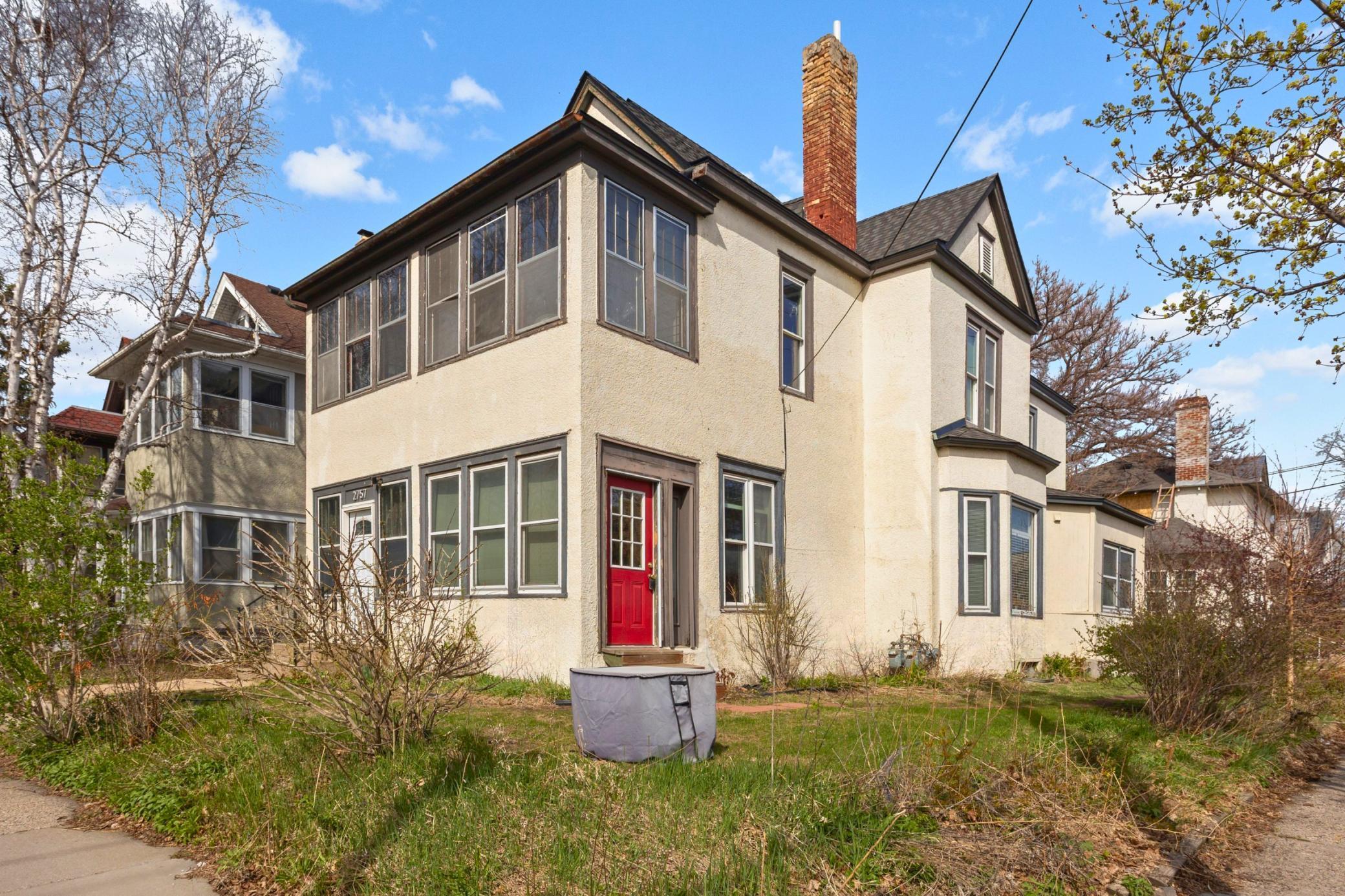 Red door is the main entrance to the airbnb unit