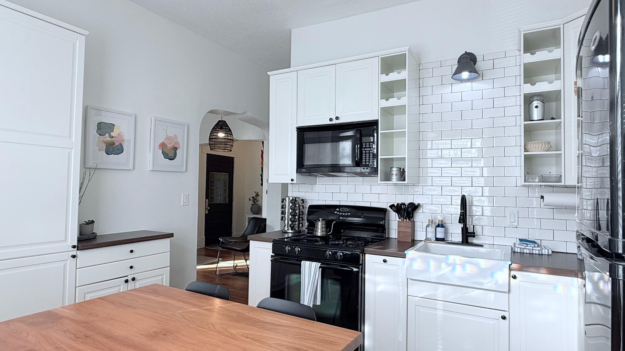 all wall backsplash, matching appliances, archways