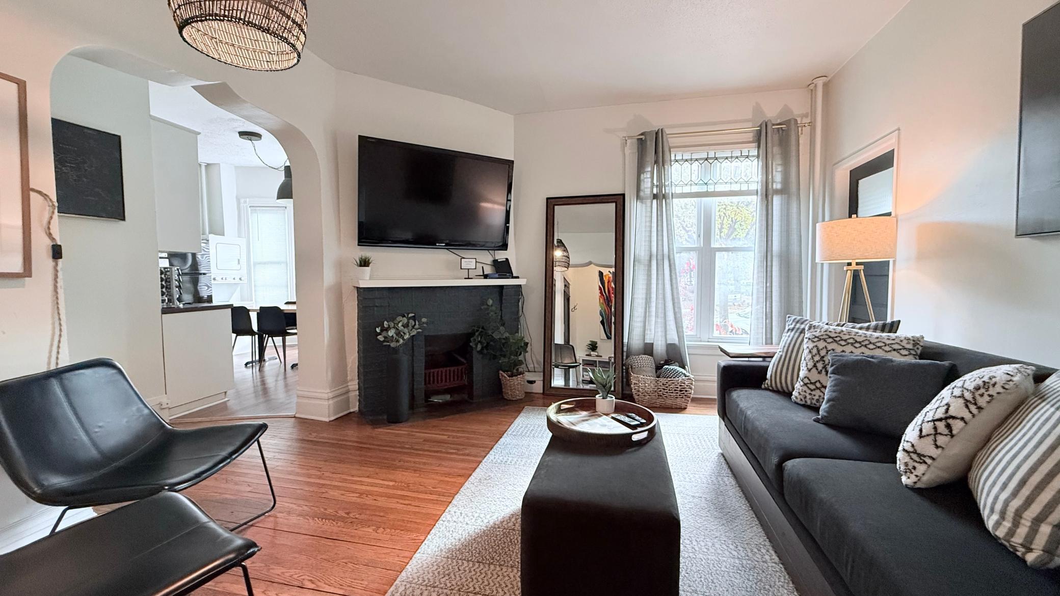 Architectural archways, charming hardwood floors, stain glass windows - loaded with Minneapolis craftsman original charm