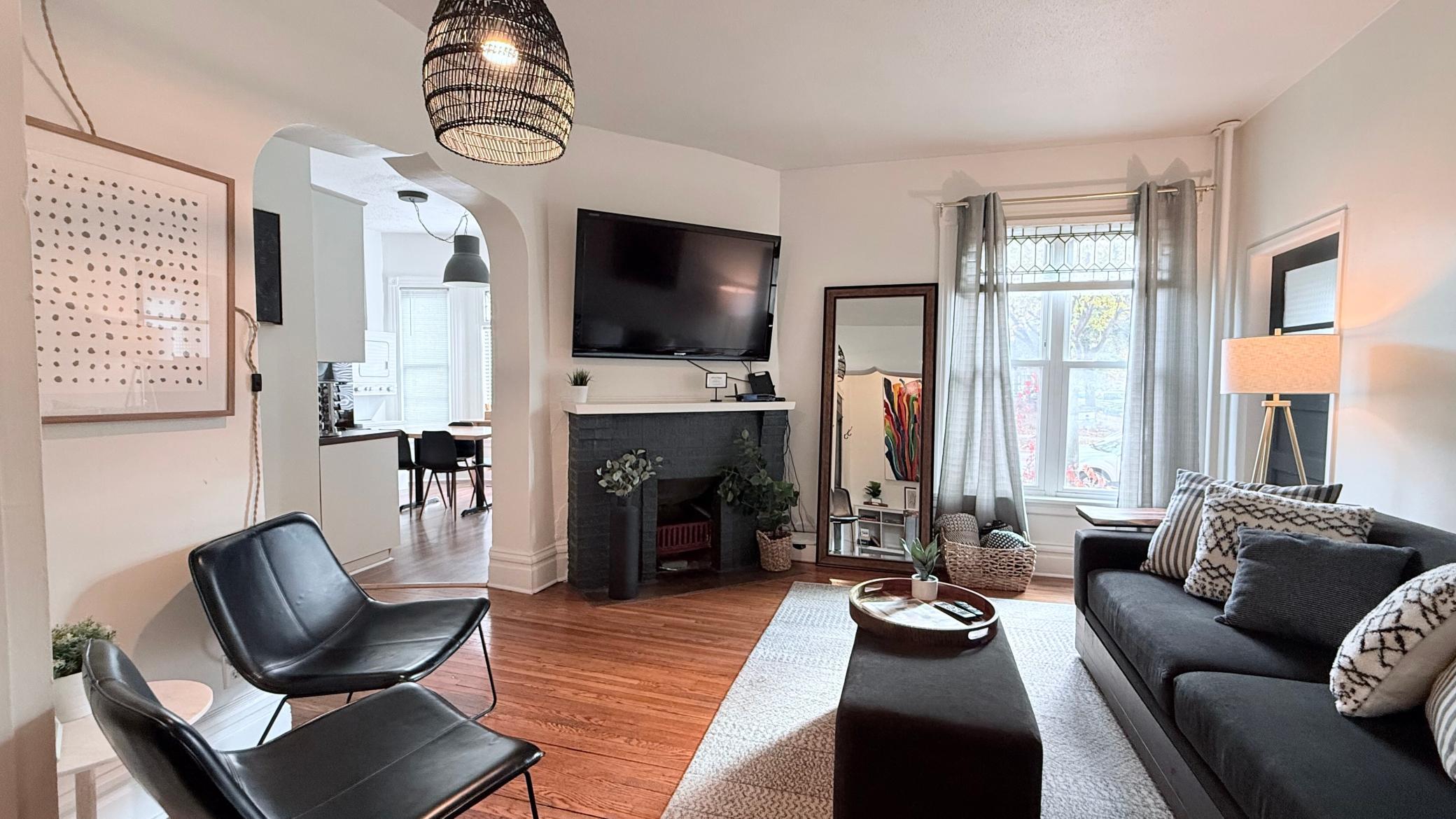 Fireplace and view from living room to kitchen