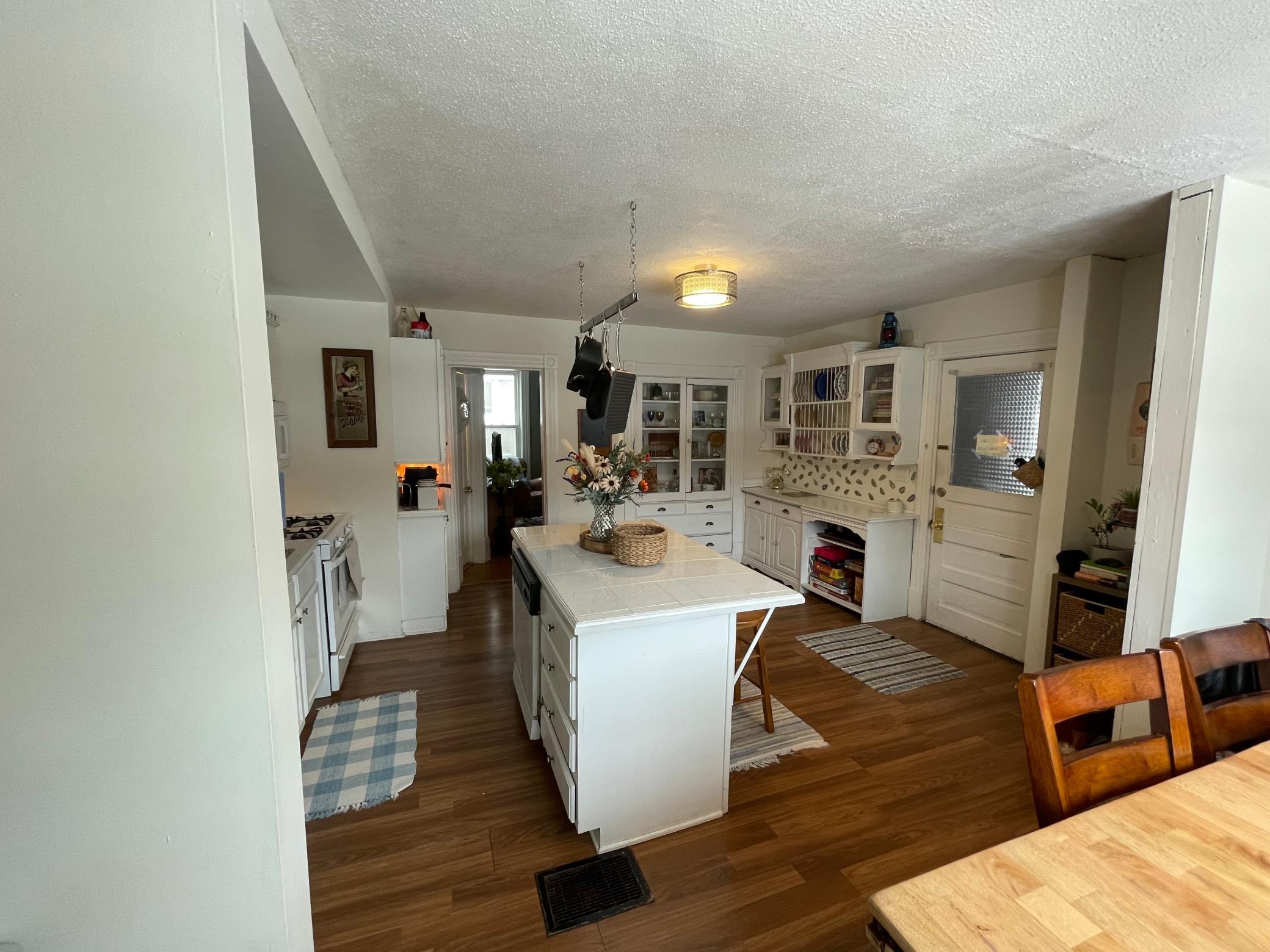 built in hutches, showing primary entrance into kitchen