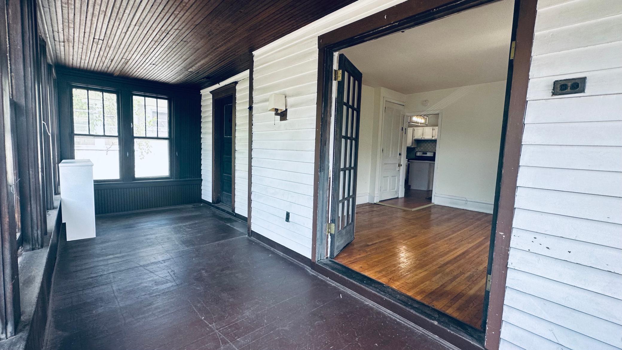 Charming sunroom that spans the length of the property. Could be used as an extra bedroom, insulated and heated