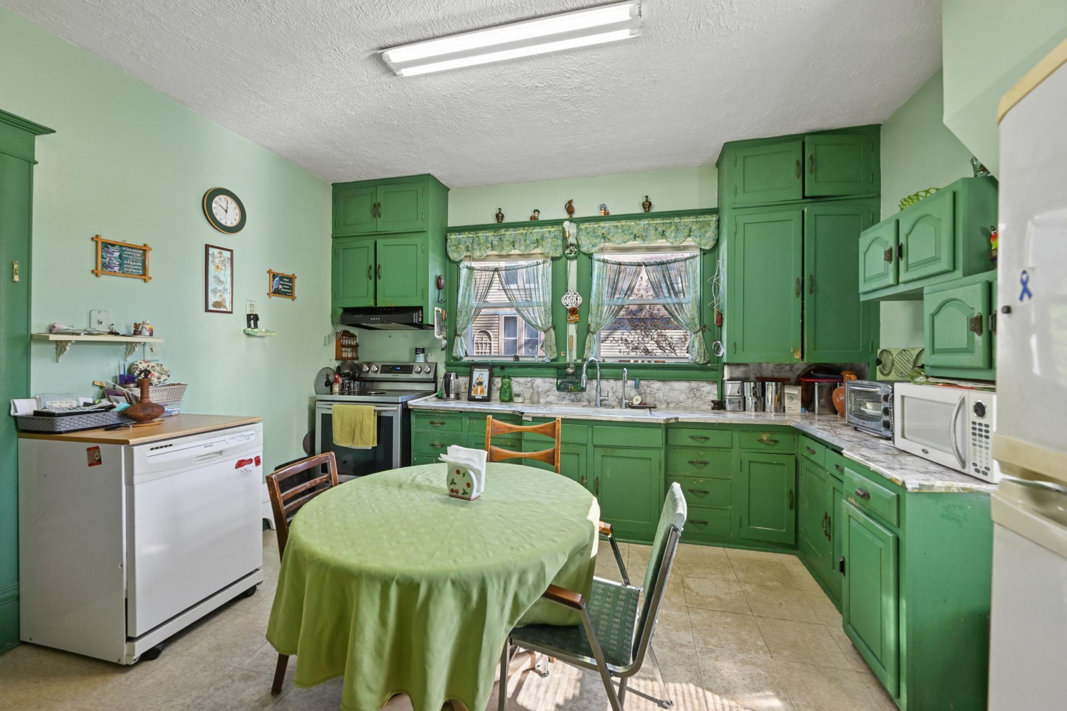 The kitchen features a portable dishwasher.