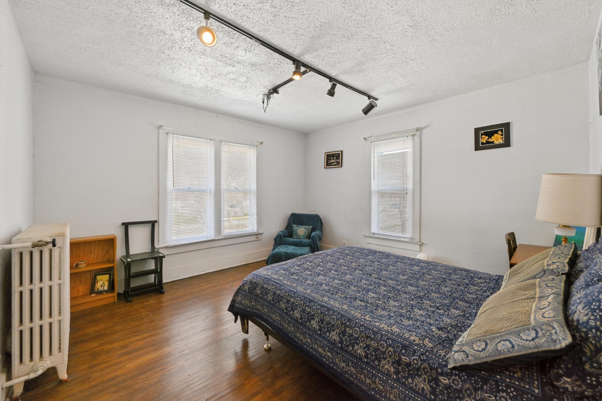 The third bedroom features hardwood flooring and a walk-in closet.