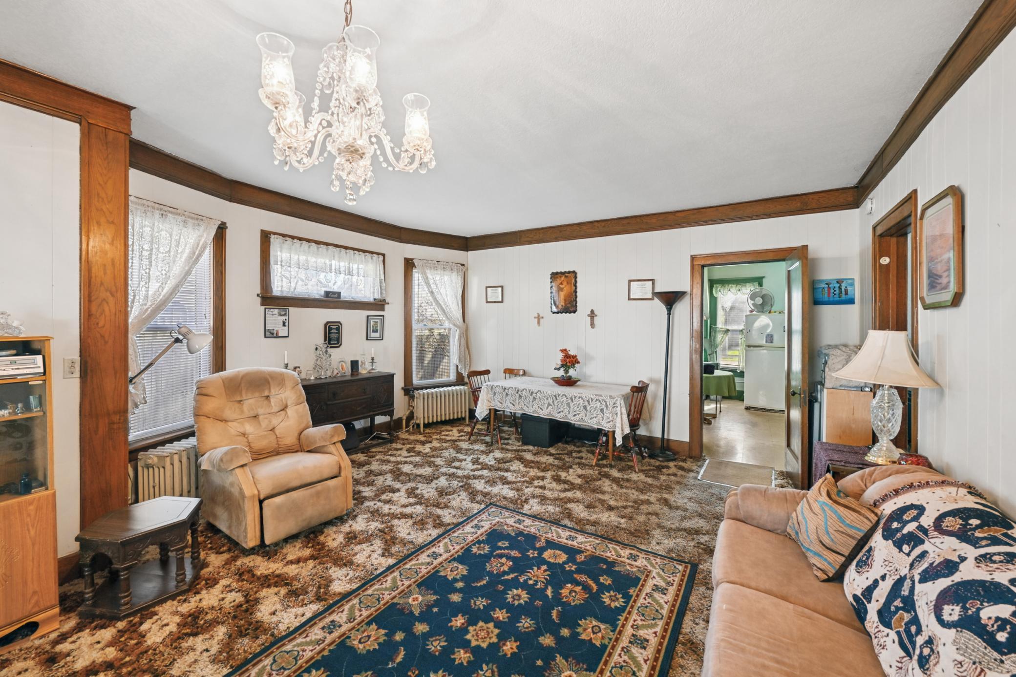 Stunning stained-glass windows in the living room add charm and character.