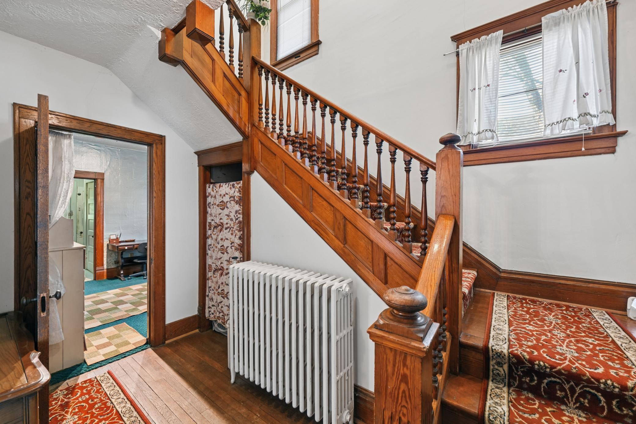 This home is a showcase of history, featuring exquisite original woodwork.