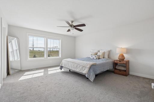 Upstairs Bedroom with Ceiling Fan and private Views
