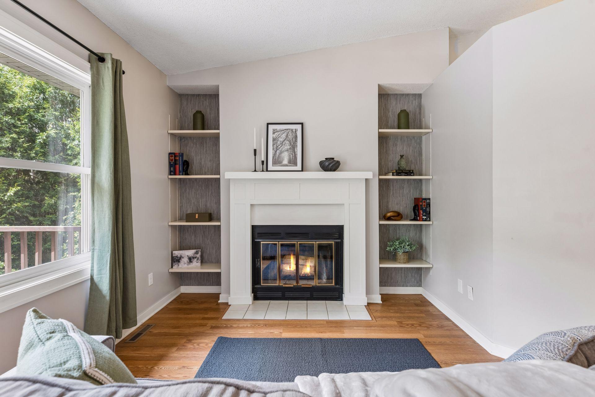 Built-in bookshelves surround the fireplace