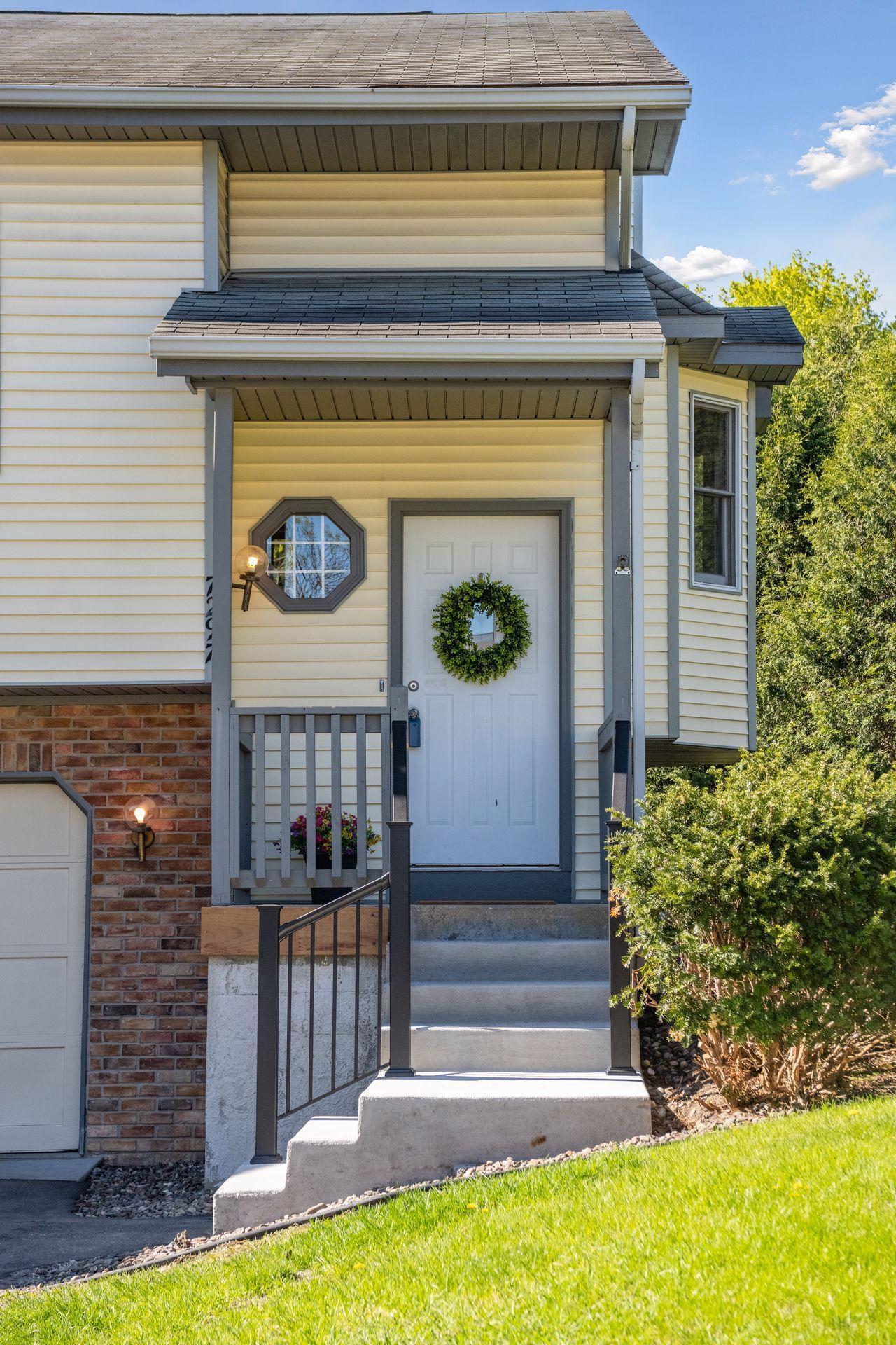 New concrete front stoop greets you upon entry
