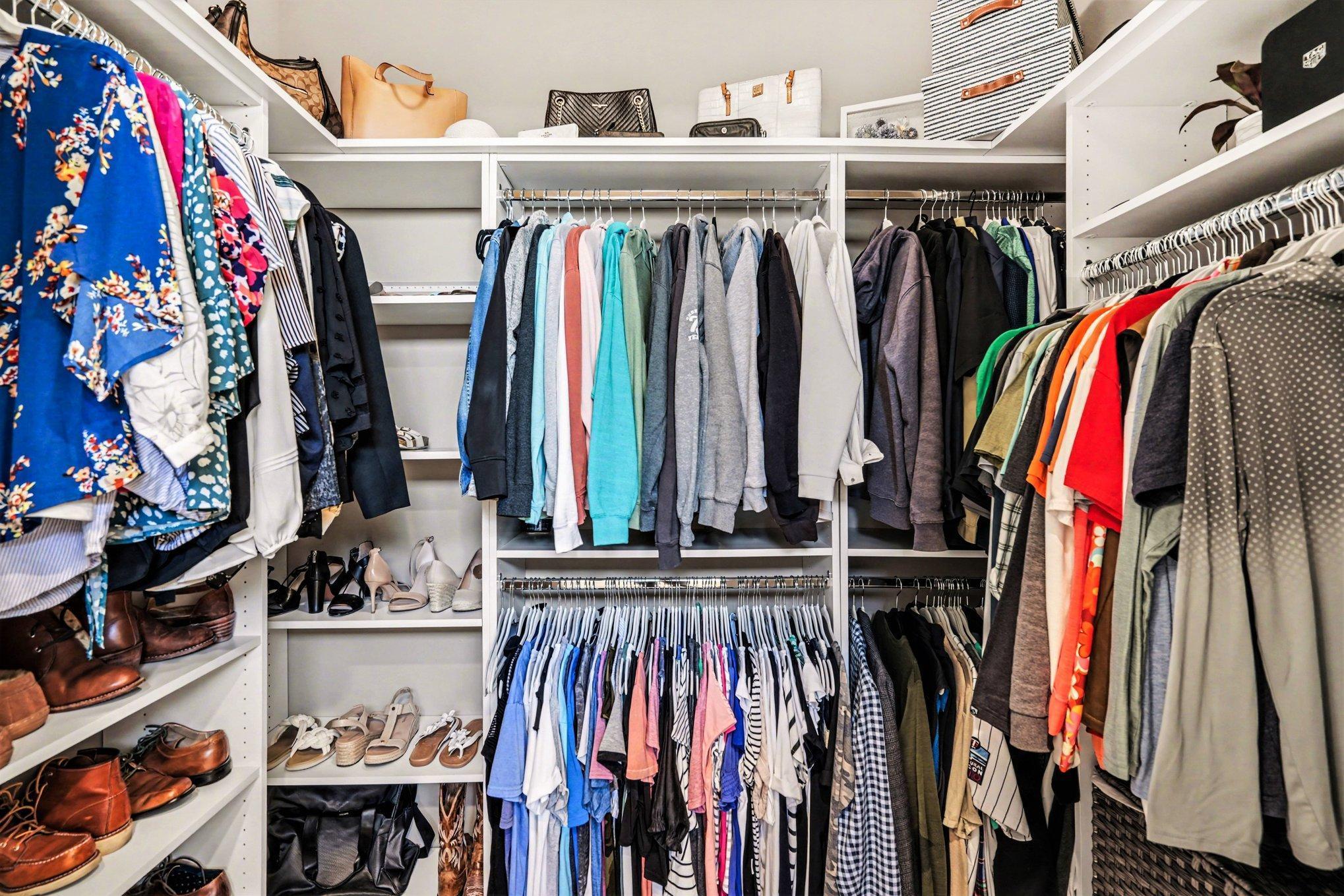 Primary closet with custom shelves and space to fit it all! You will be able to have all the clothes you want!!