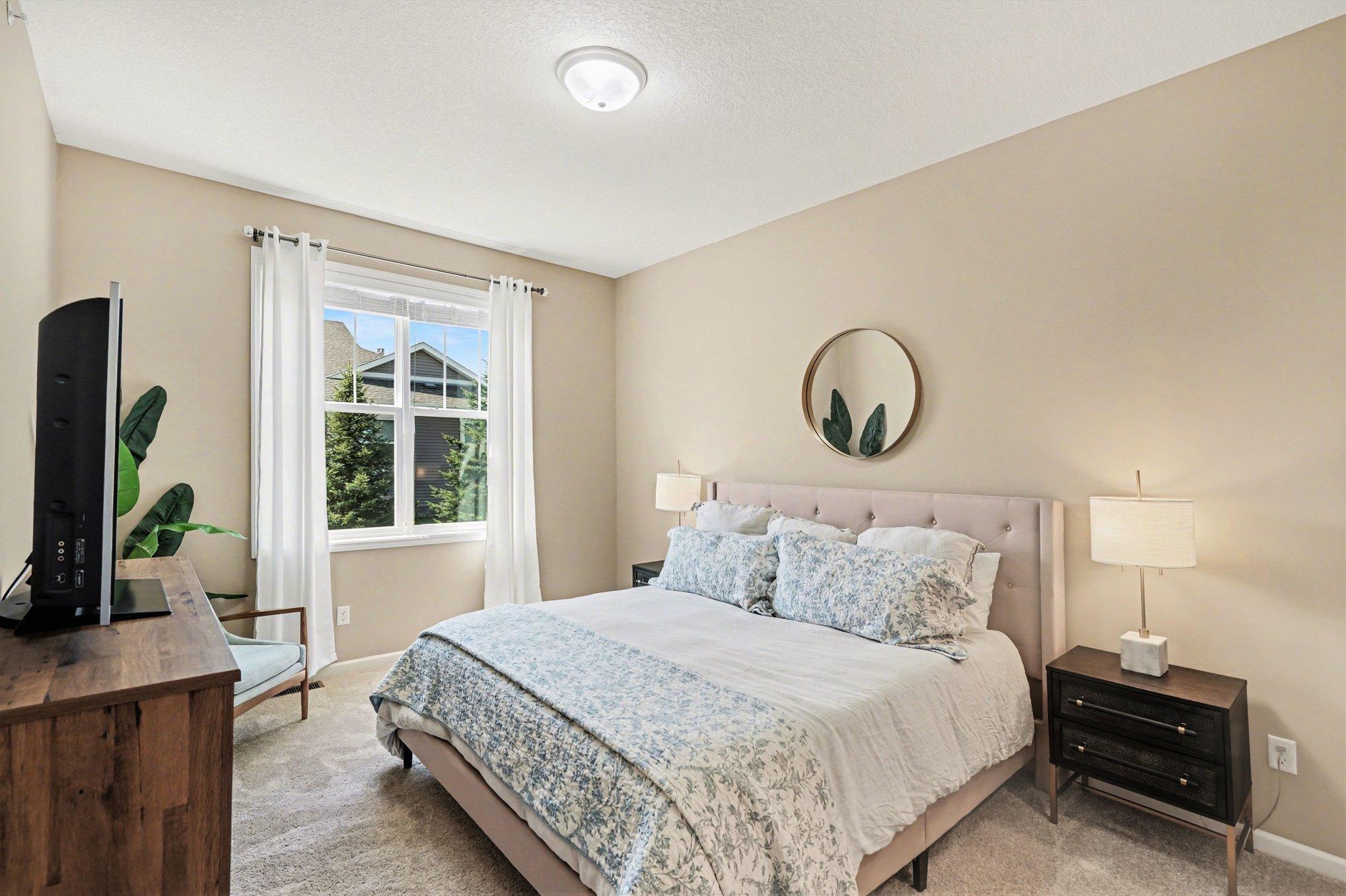 This primary suite is generous in size... king bed pictures in the photo!