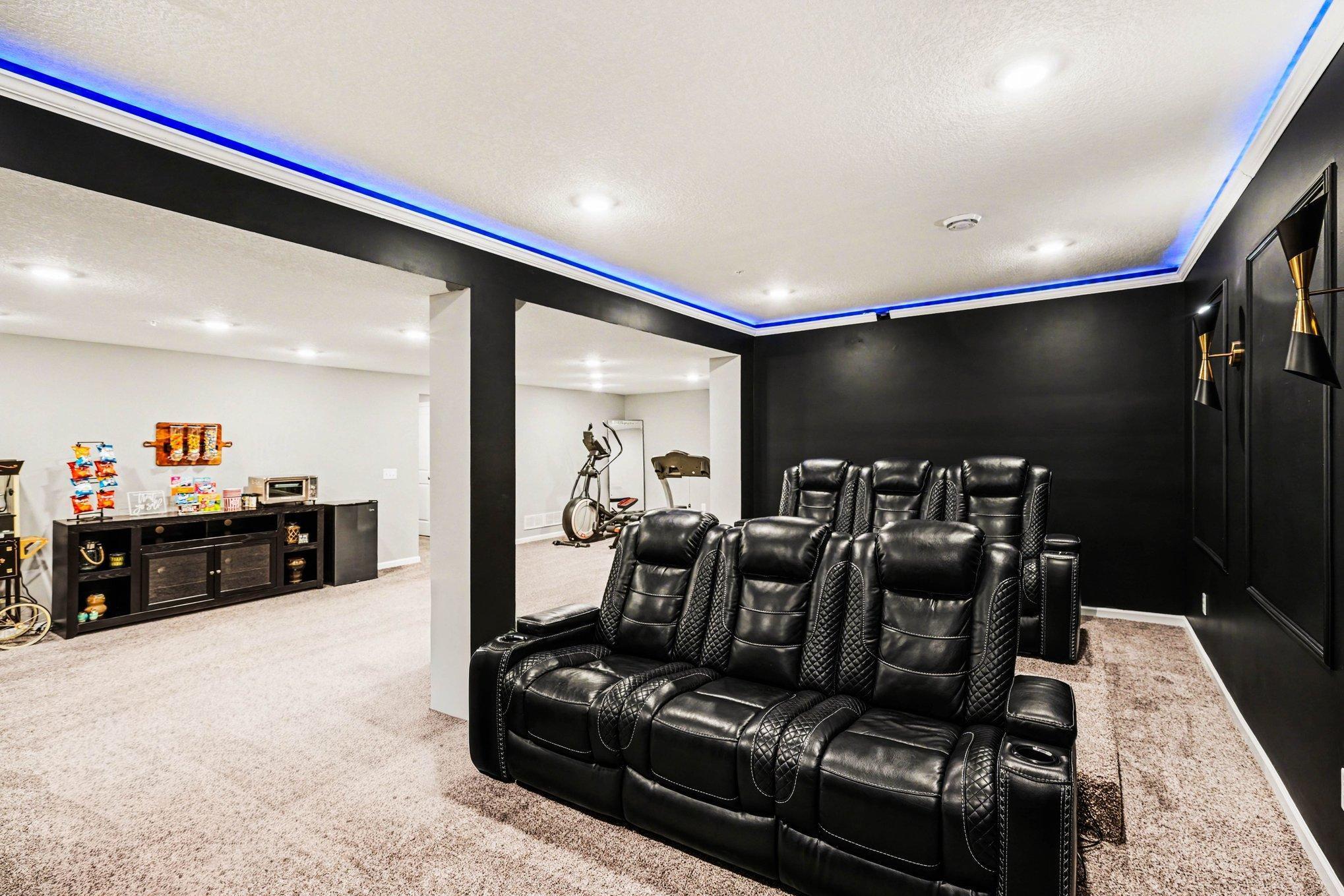You will love watching movies in this theatre room... yes the recliners stay with the home