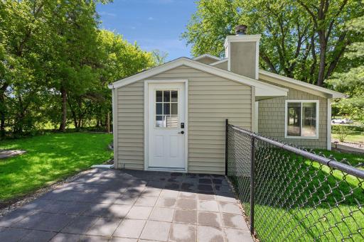 New paved side entry with access from garage to the home