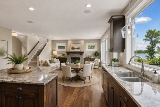 Virtually staged to show the addition of an informal dining room between the kitchen and great room.