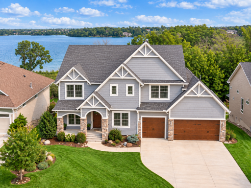 Custom McDonald built home showcasing water views and distinctive architectural detail, and quality craftsmanship throughout