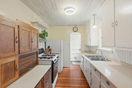 Kitchen has a stylish vibe with refinished decorative pine/fir floors