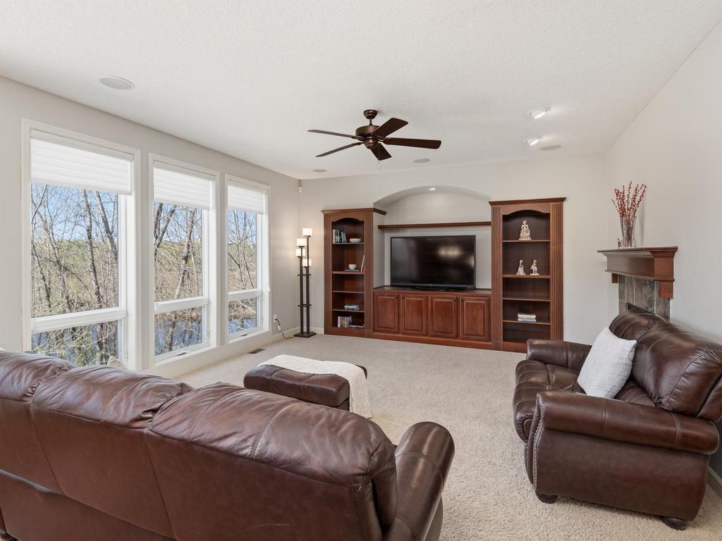 Great Room has large windows with an amazing pond view!