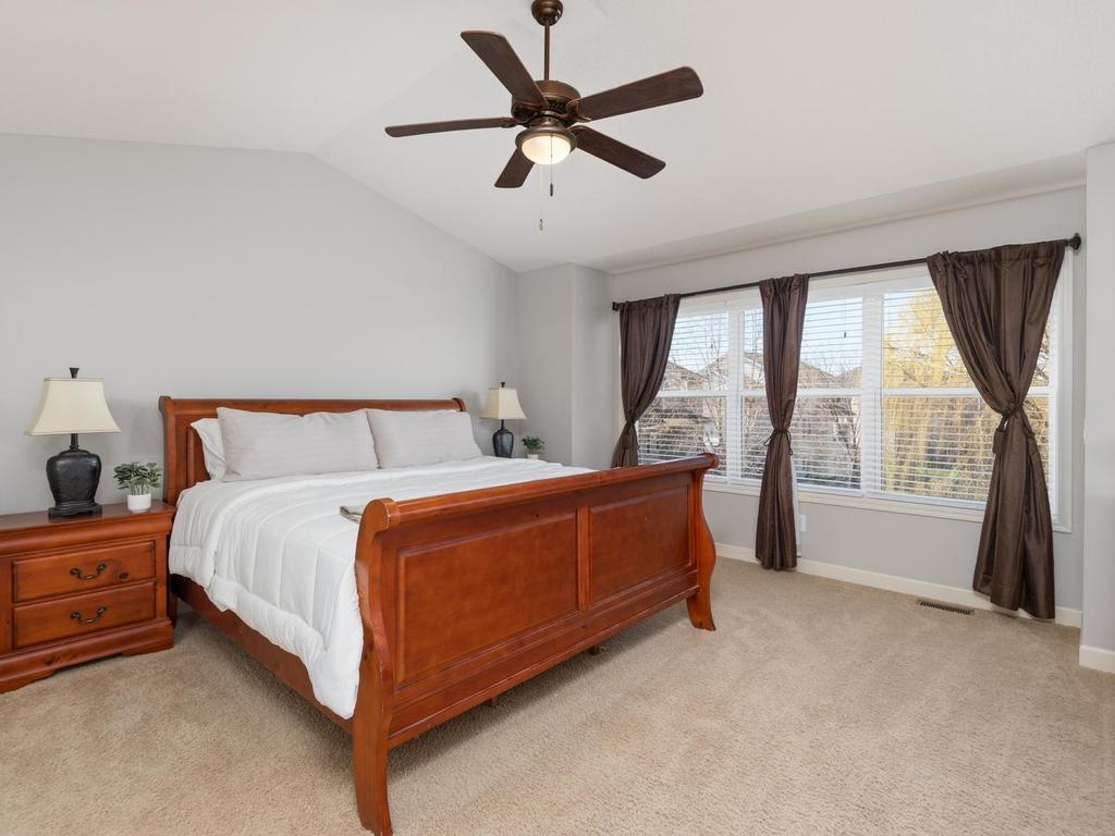 Upper-level vaulted Primary Suite has a large walk-in closet & private Full Bath.