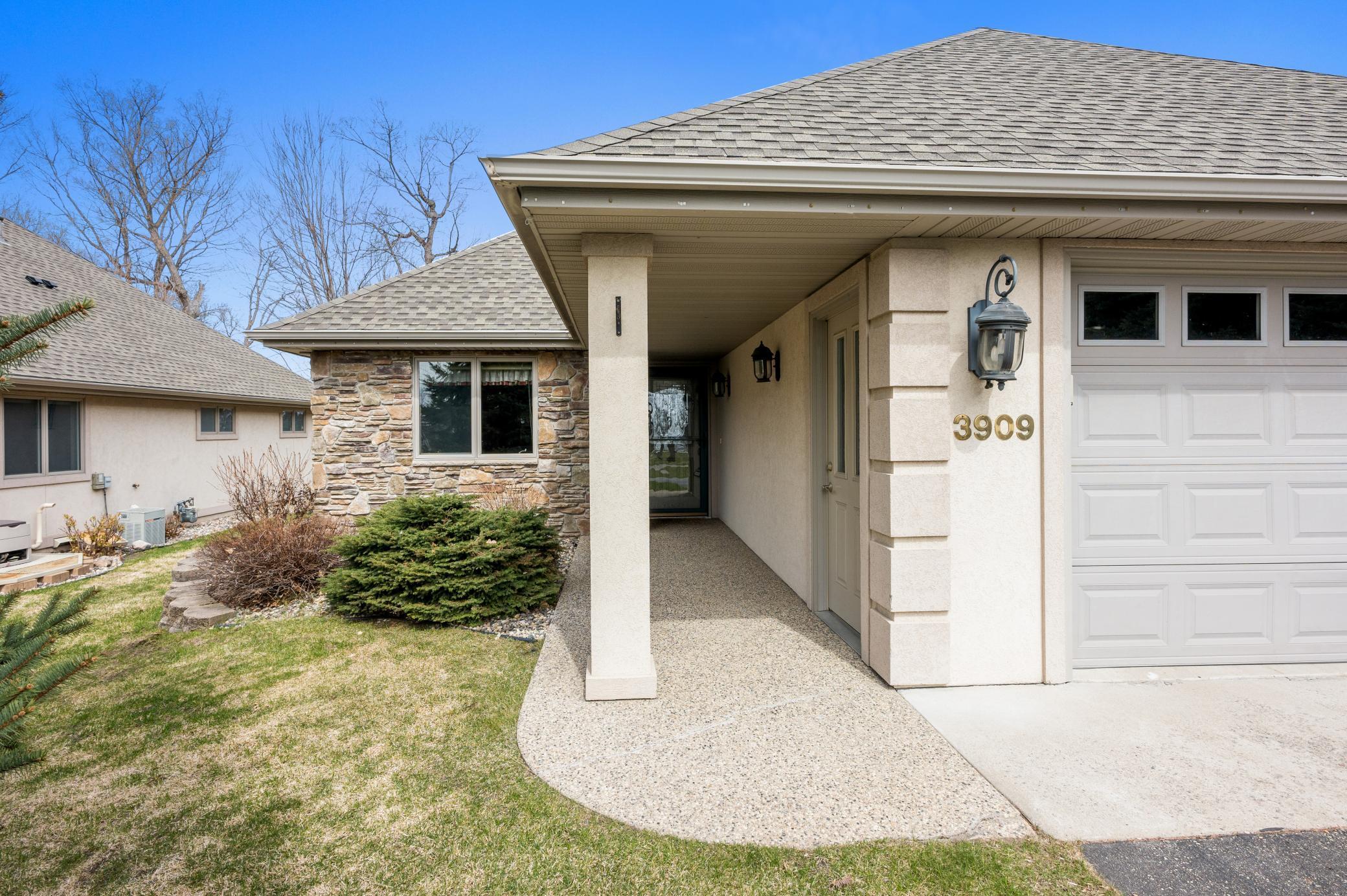 Covered front entrance-aggregate sidewalk