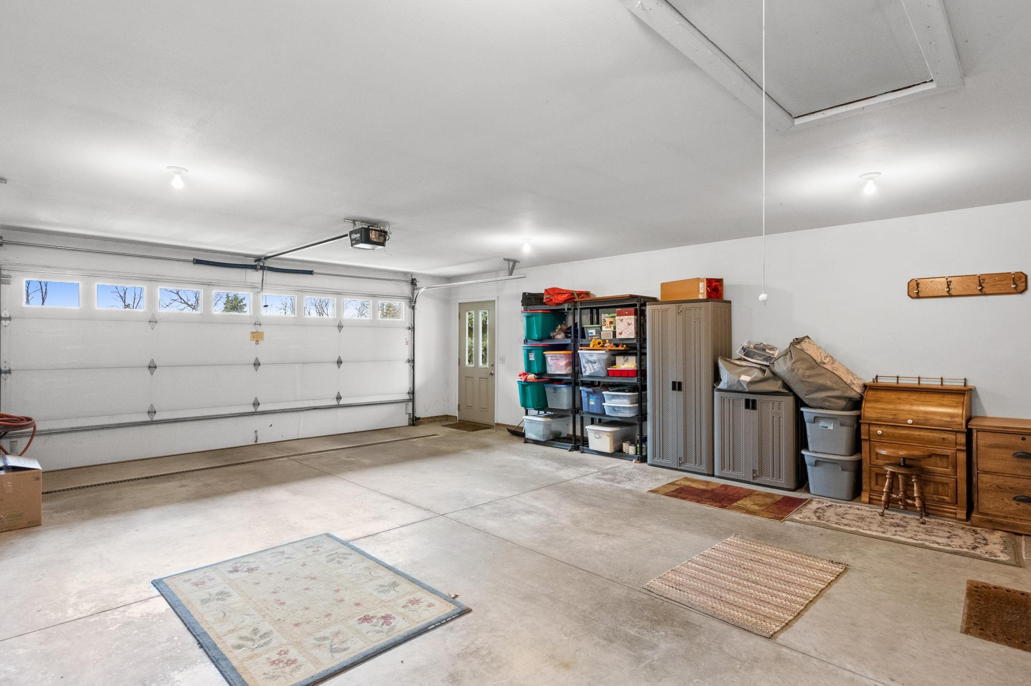 Finished garage with drain and storage above
