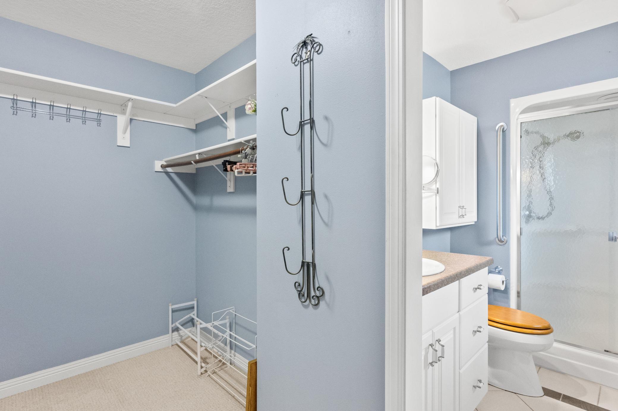 Primary walk-in closet and private bath