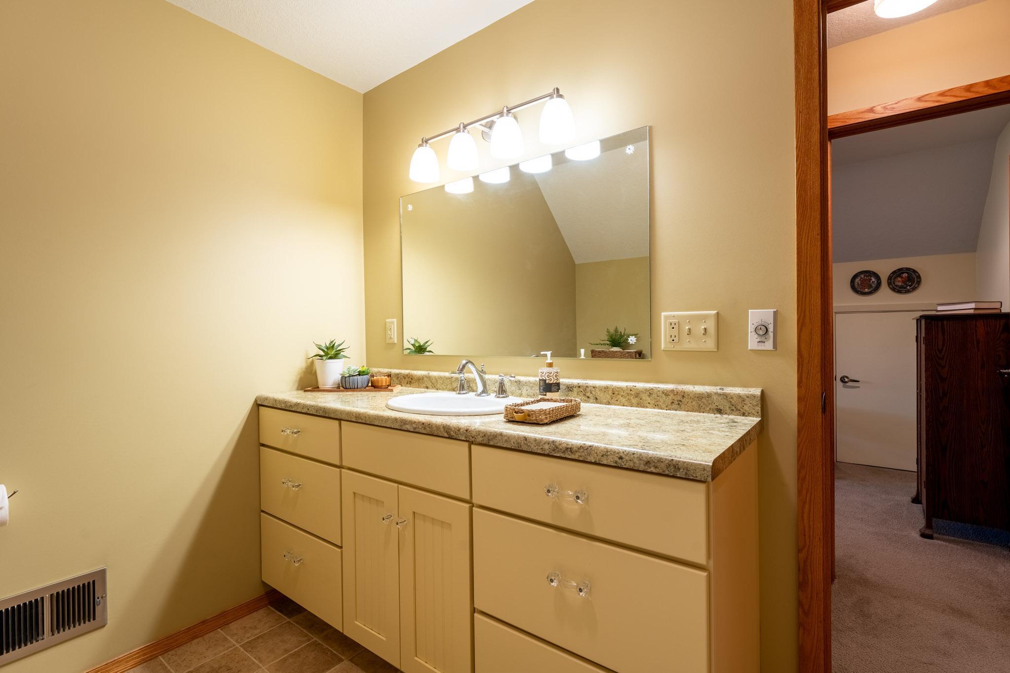 Upstairs full bathroom - large vanity with lots of counter space.