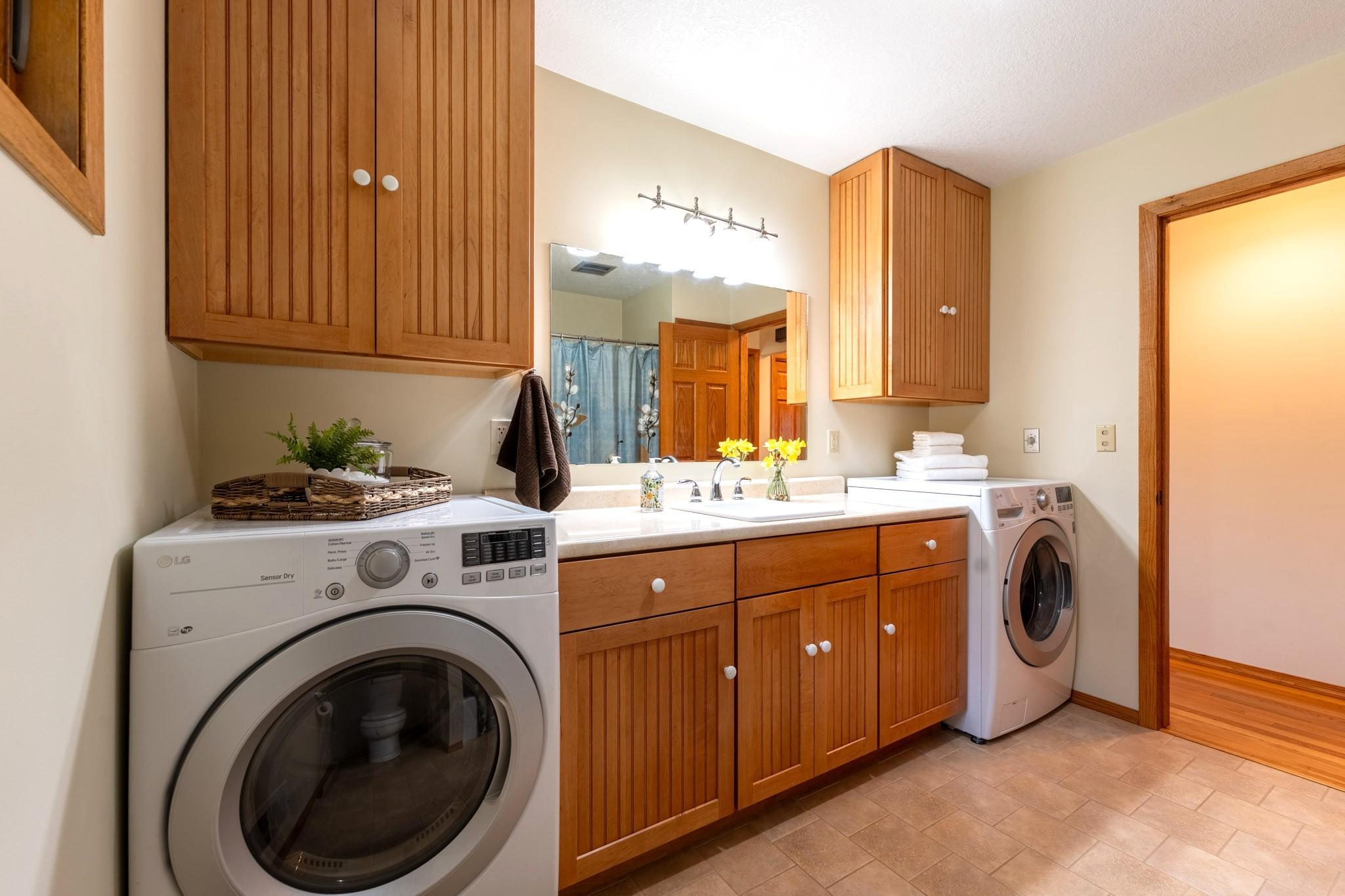 Main level full bathroom with laundry.