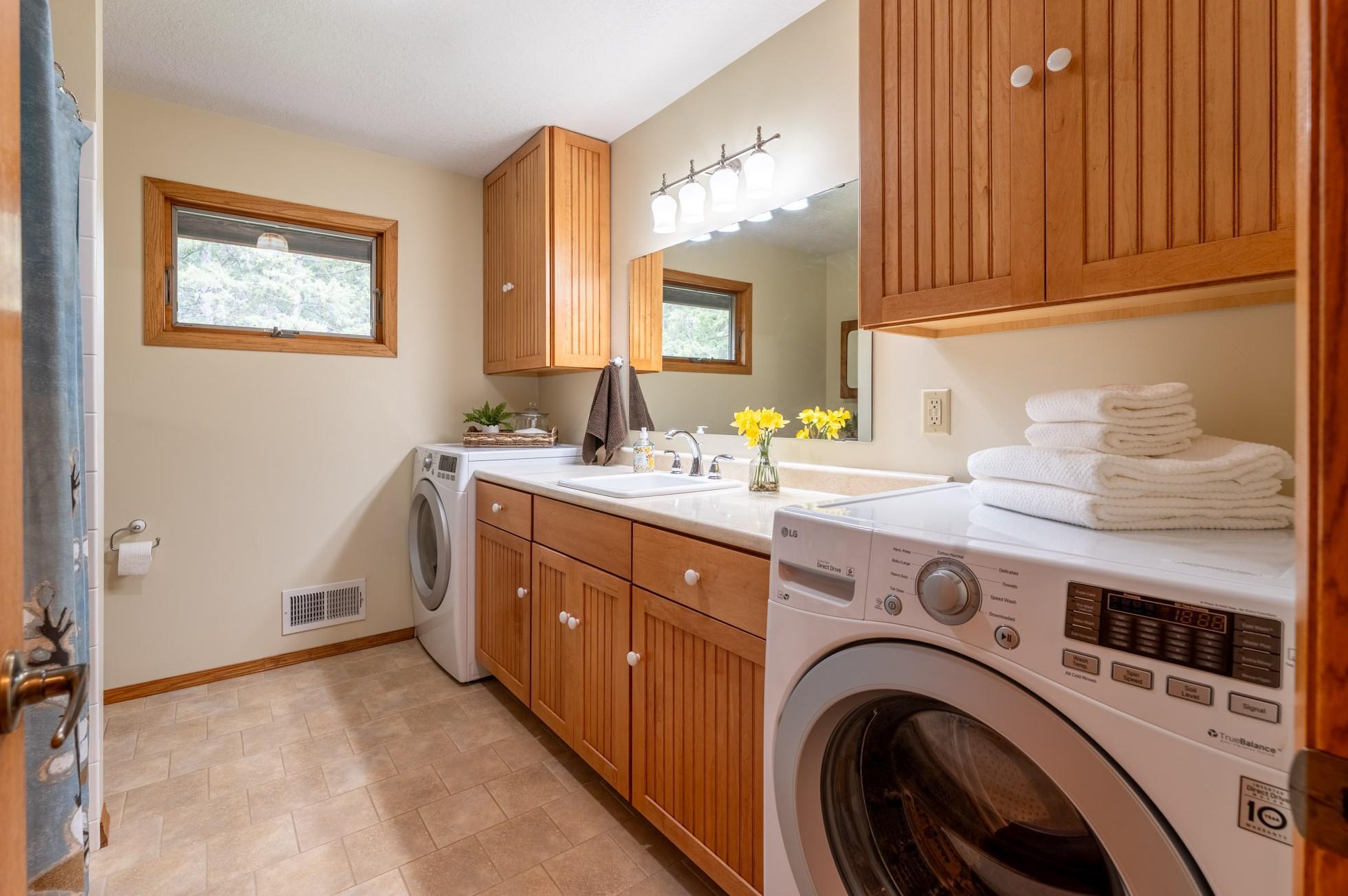 Main level full bathroom with laundry.
