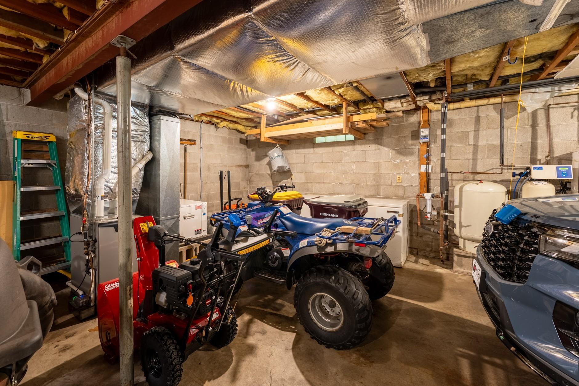 Mechanicals include a LP forced-air furnace (2021) used in conjunction with a geothermal system for efficient heating and cooling, 50 gallon water heater, water softener-owned, well pump (2011), Spin-down water filter system (new filter April 2026).