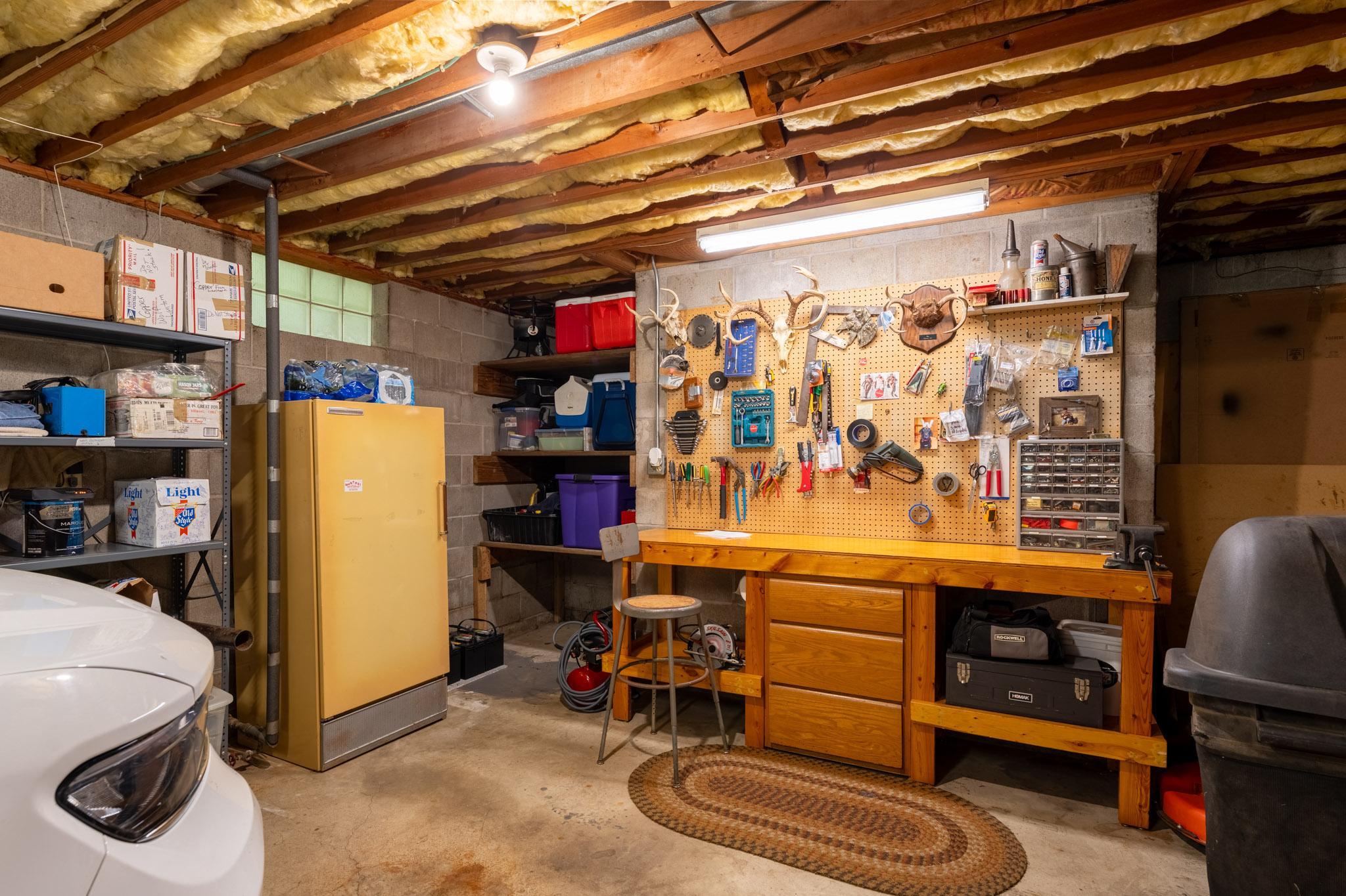 The extra long garage allows for plenty of room for a workbench.