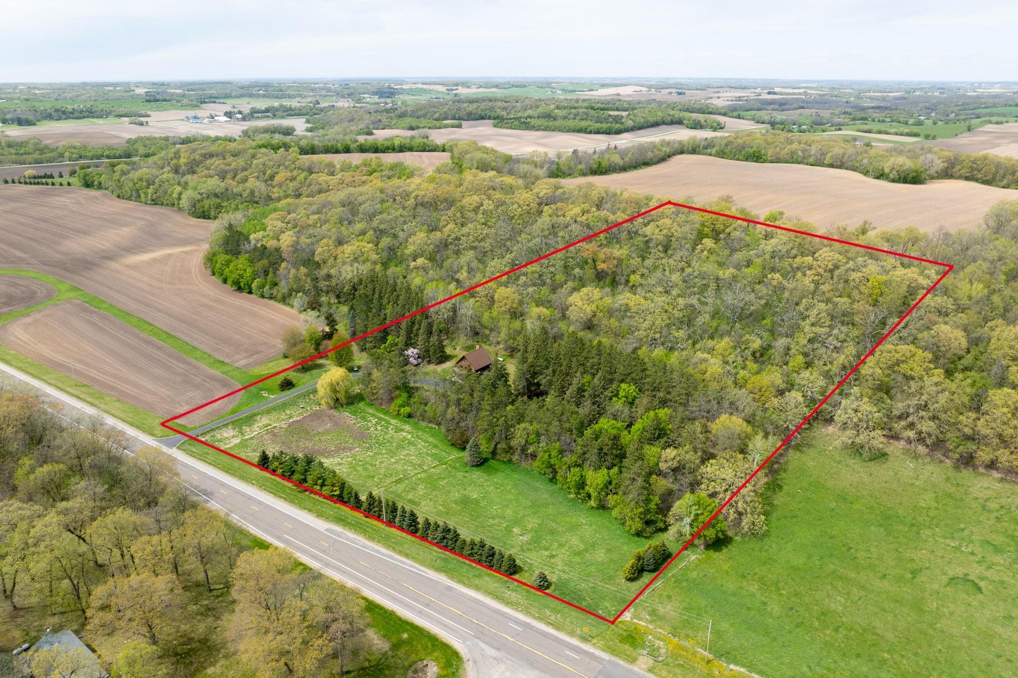 This 11 acre gem is surrounded by gently rolling farmland with rotating soybean and corn crops, the setting is ideal for those seeking a quiet country homestead, a nature escape, or a prime hunting property.