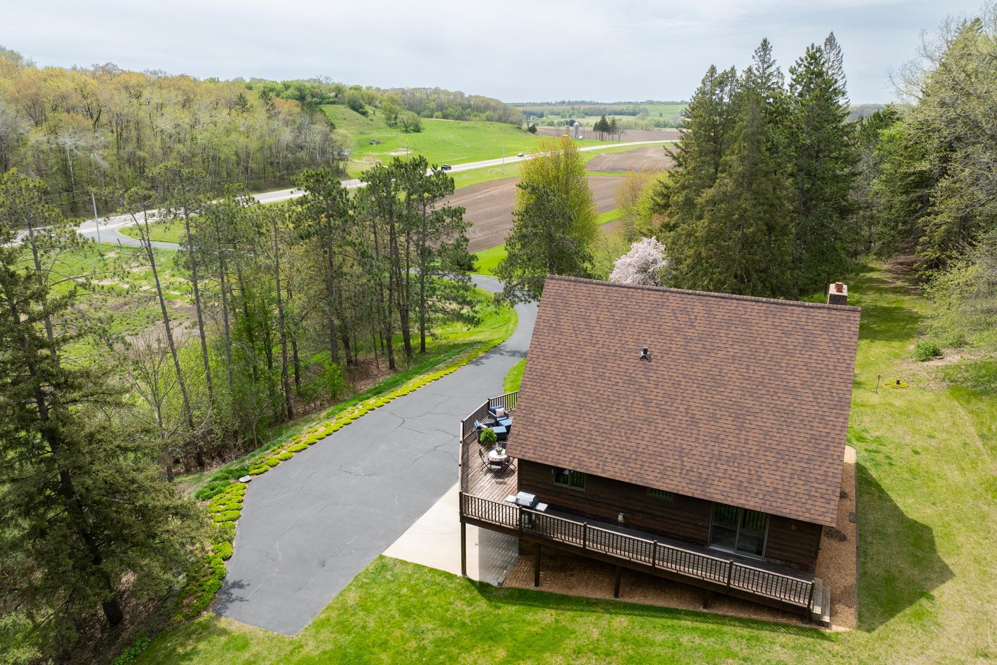 The Hosta lined Bitumous (asphalt) driveway was installed to replace a gravel drive.