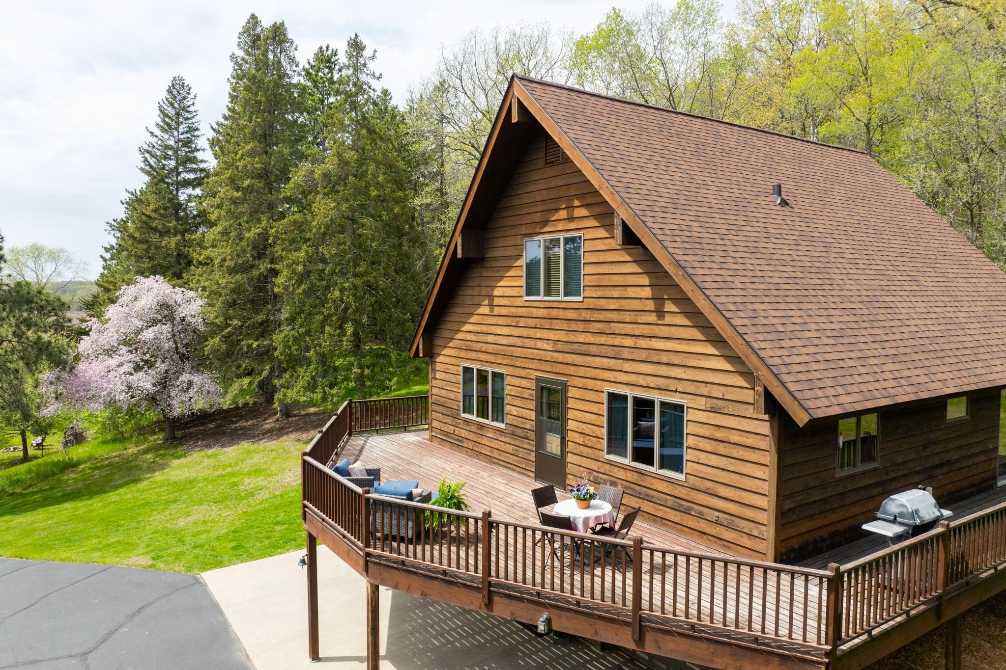 Doors lead out to an expansive wraparound cedar deck, perfect for everyday living and entertaining!