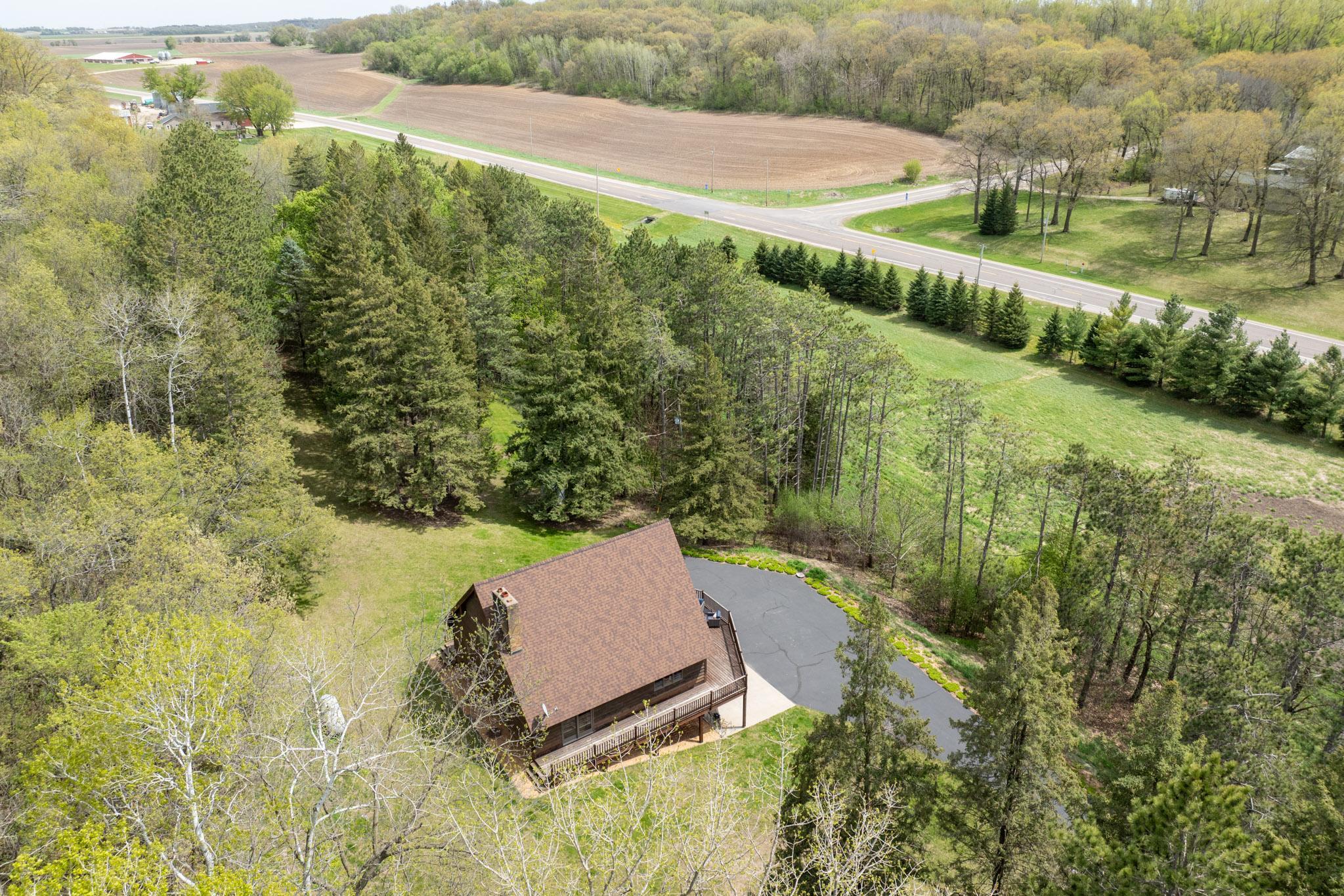 Lots of evergreens surround this beautiful home.
