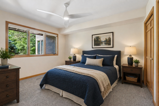 Additional lower-level bedroom offering flexible use for guests, office, or hobby space. This photo has been virtually staged.