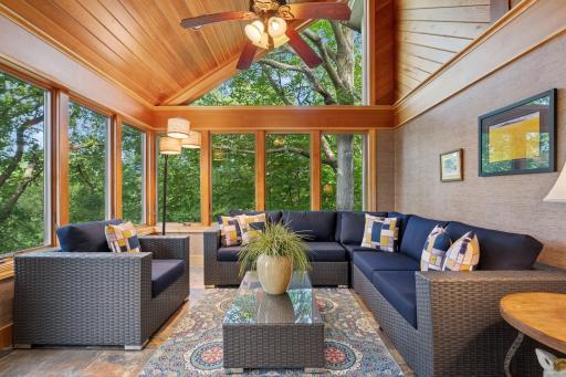 Four-season porch designed to maximize wooded views and year-round enjoyment.