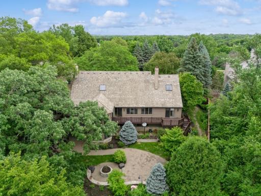 Private wooded surroundings create a peaceful setting with scenic views in every direction.