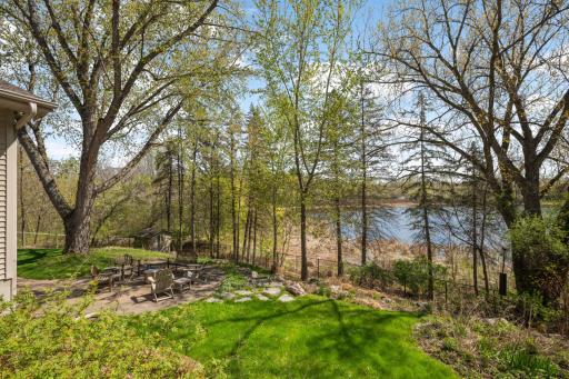 View of your backyard, custom patio, and Snyder Lake shoreline!