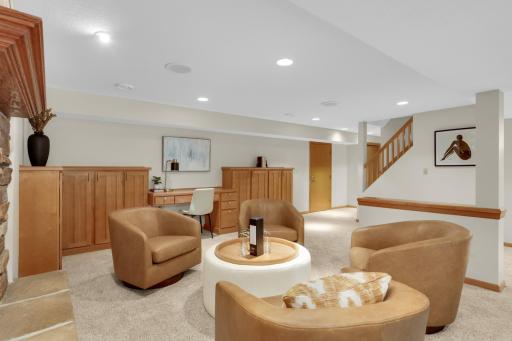 Huge entertainment space in lower is perfect for a game area separate from TV viewing; you see the built-ins, but the fireplace is not in view here.