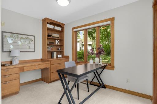 Owner's serene study features custom built-ins, sequestered in the primary suite.