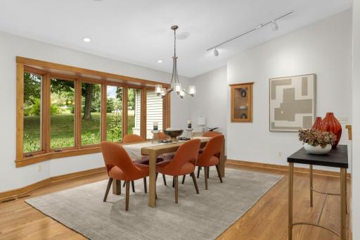 This is the opposite view of the dining room; you can see the beautiful bank of windows warming the room.