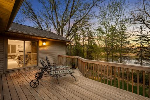Sweet sunset image of the deck off the great room/lake room. Such a tranquil setting!