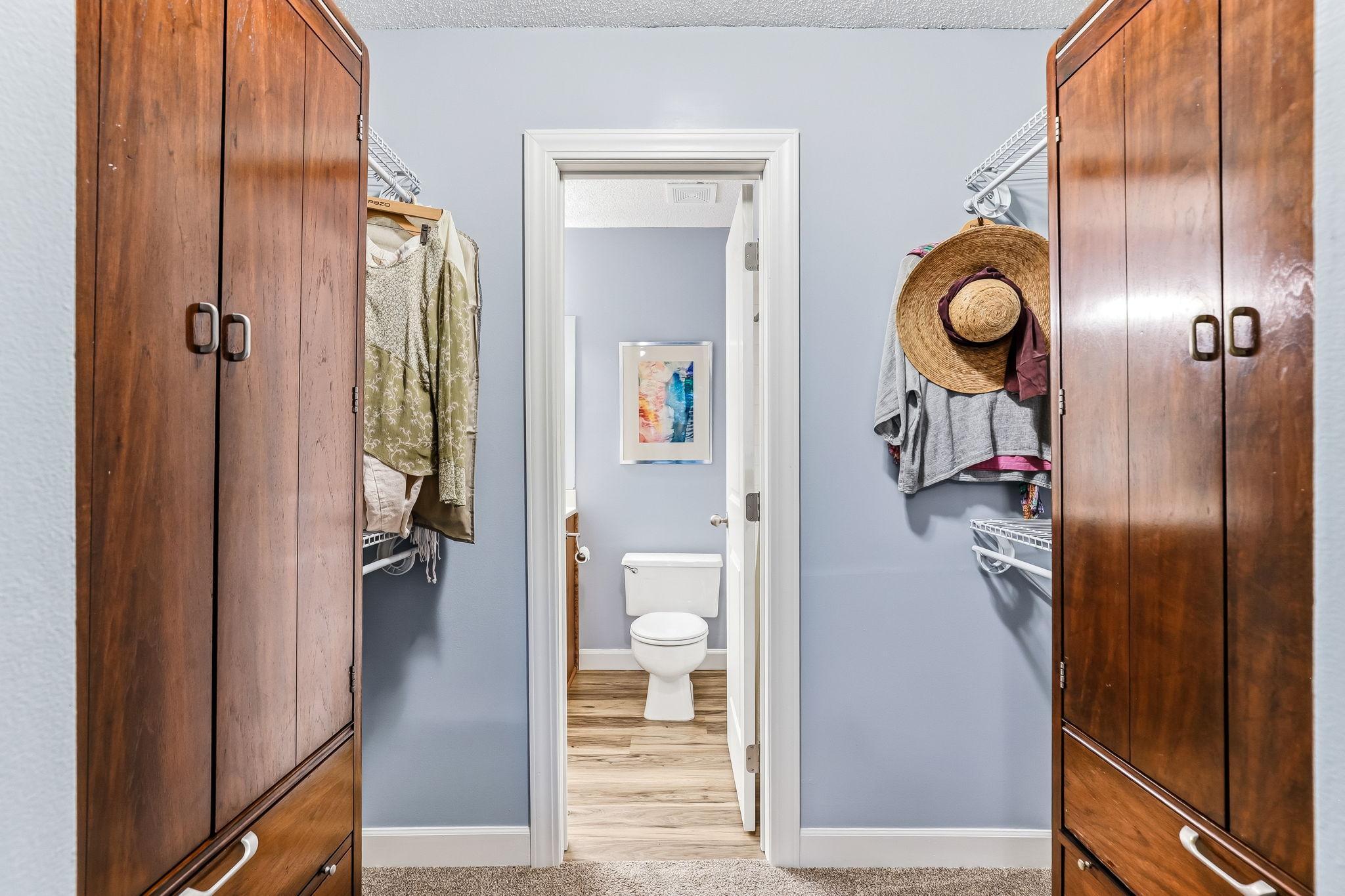 Primary bedroom features a spacious walk-in closet for convenient, organized storage.