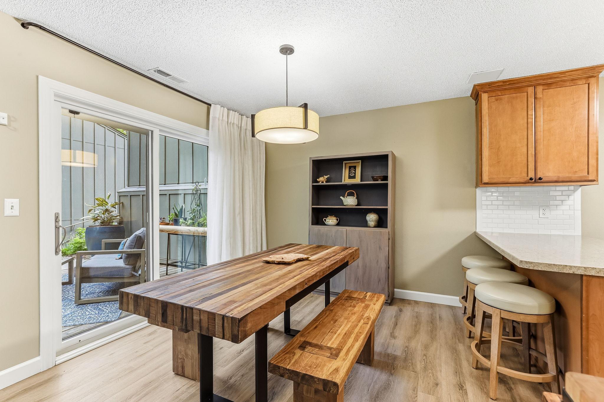 Sliding glass doors open to the deck, filling the space with natural light and easy outdoor access.