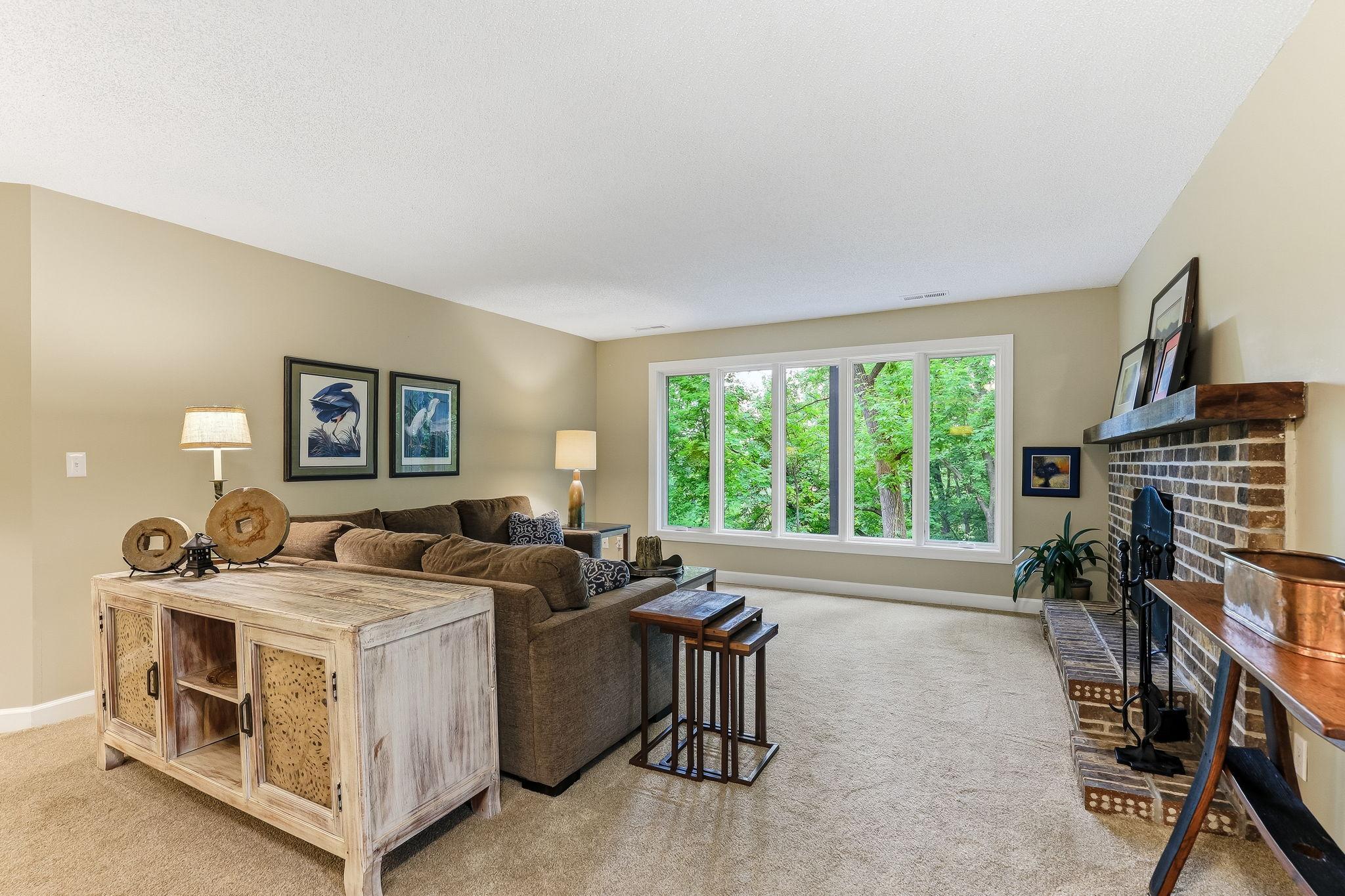 Natural light pours across the open space, highlighting the room’s generous layout and inviting atmosphere.
