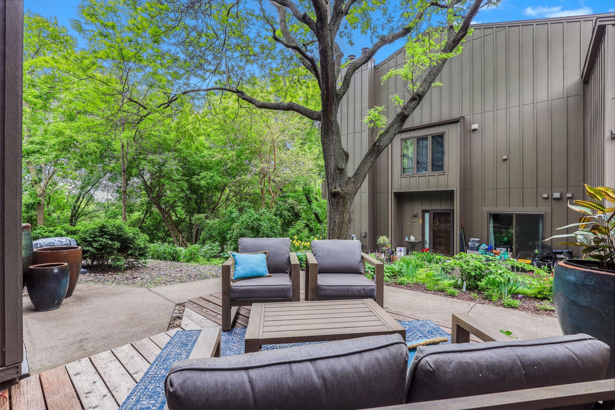Deck comfortably accommodates seating, plants, or a grill, making it an ideal spot for morning coffee or evening gatherings.